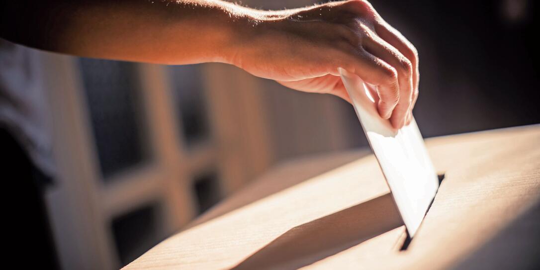 Conceptual image of a person voting during elections