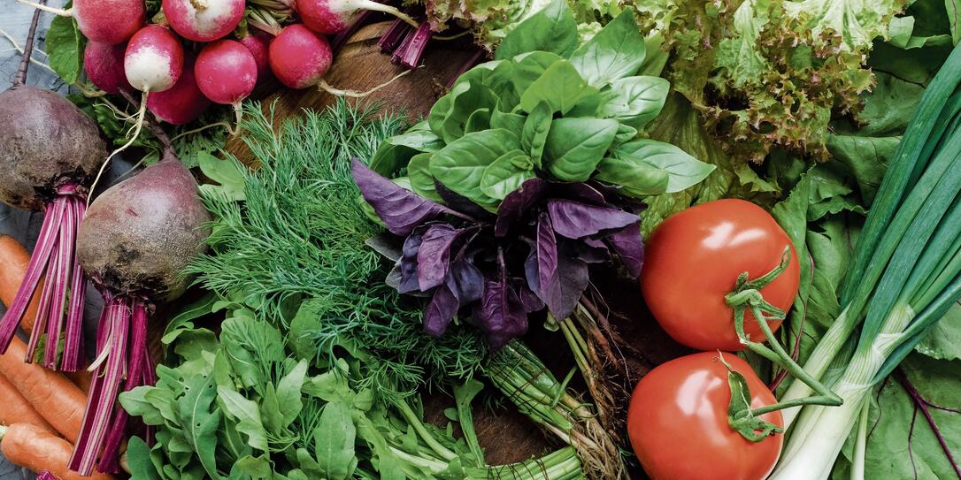 Background texture with assorted raw organic vegetables