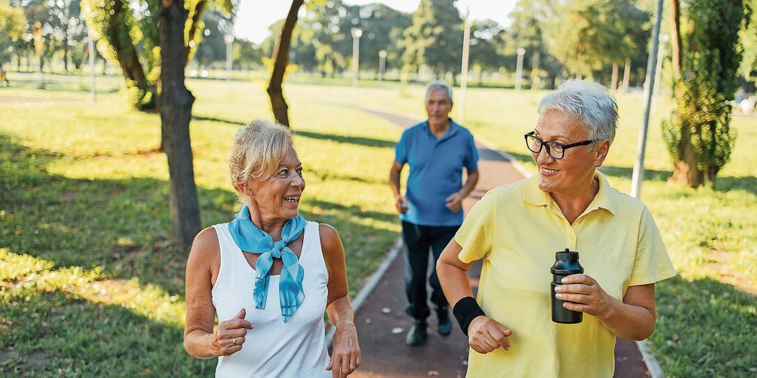 Seniors jogging in park