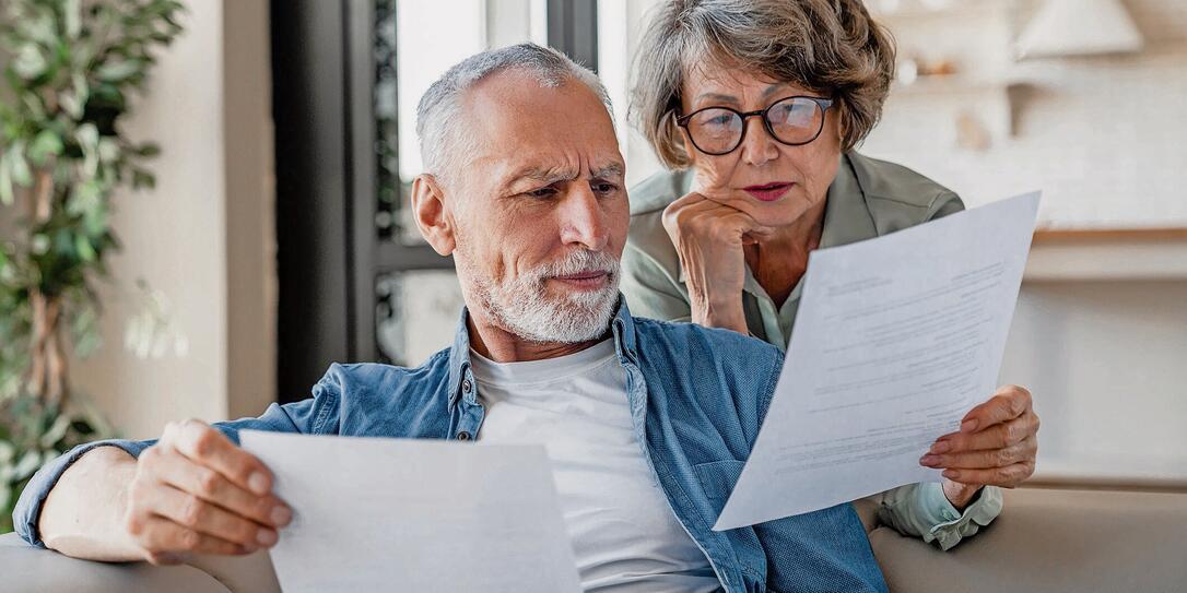 Senior grandparents reading documents, having issue problem debt with money loss