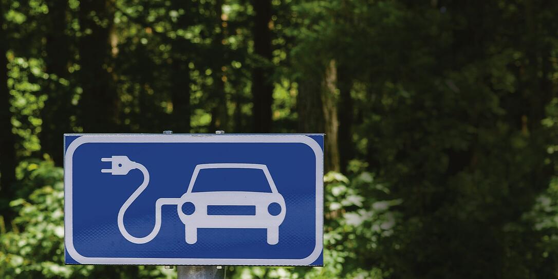 Ecology friendly electric car charging station road sign