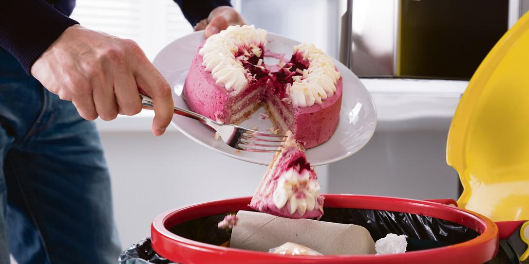 Person Throwing Cake In Trash Bin Person Throwing Cake In Trash Bin