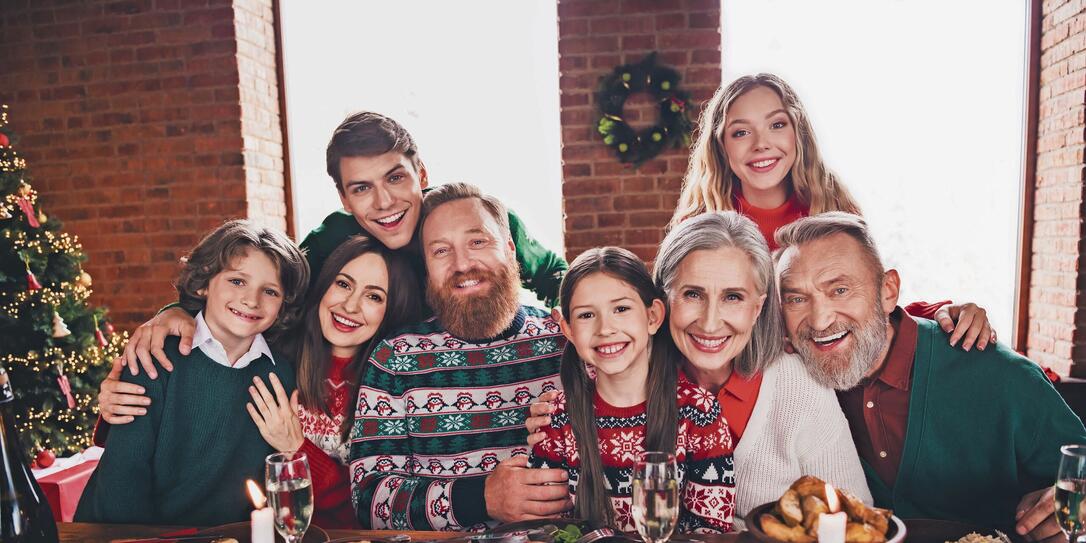 Photo of group family members cuddle posing gather celebrate christmas apartment indoors Photo of group family members cuddle posing gather celebrate christmas apartment indoors