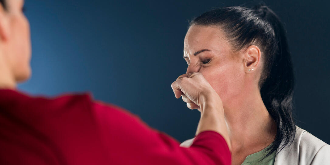 Businesswoman punching her colleague Businesswoman punching her colleague