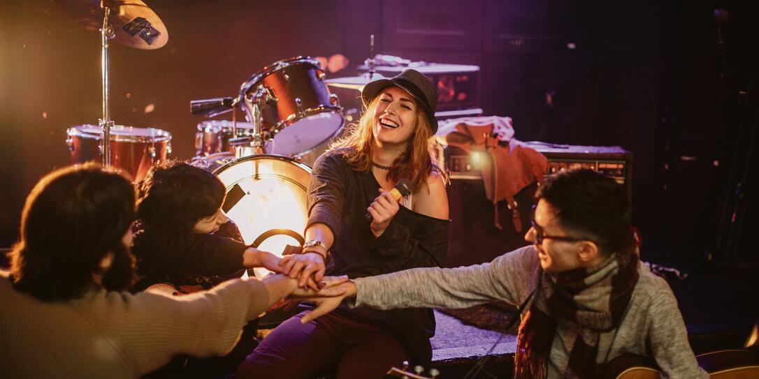 Band members holding hands