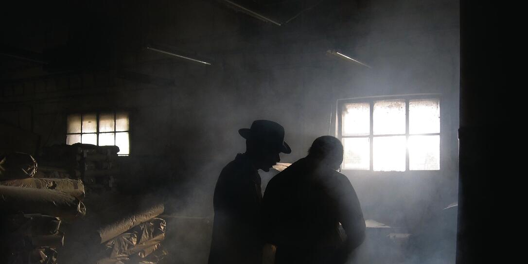 Silhouette of Men in Smoke