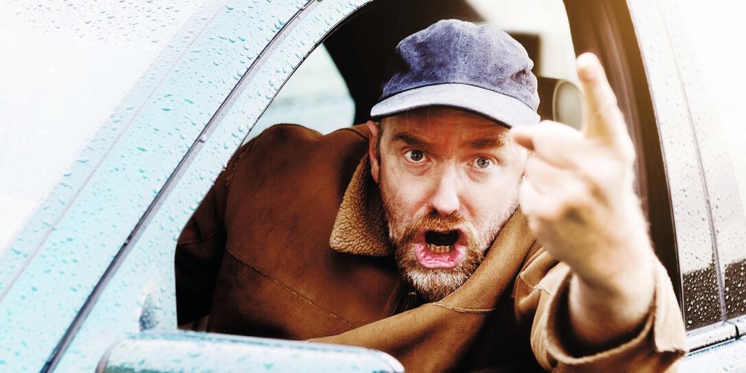 Angry male driver points finger accusingly, shouting and threatening Angry male driver points finger accusingly, shouting and threatening