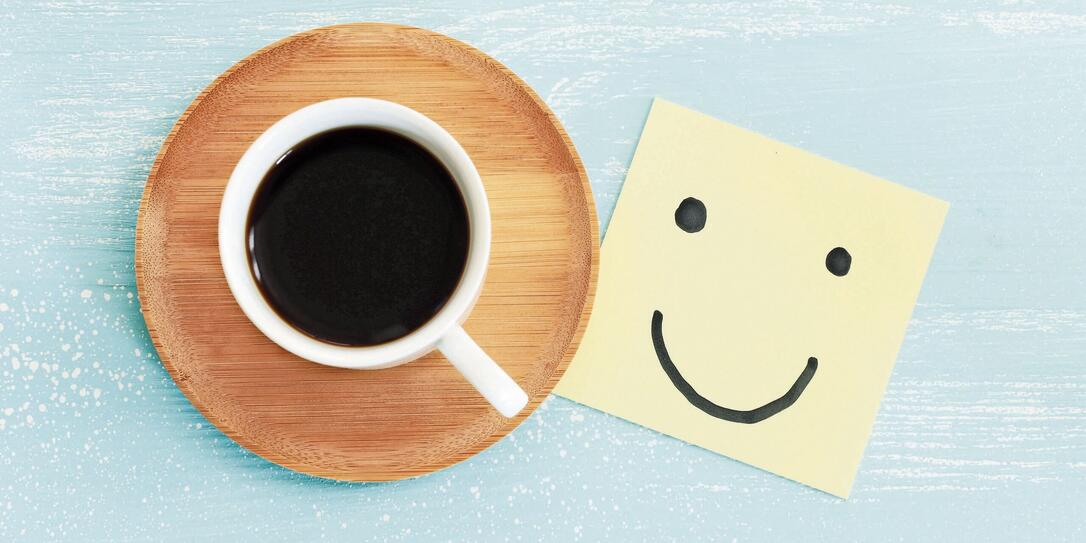 A cup of coffee with the text think positive