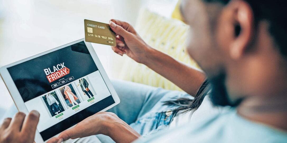 Couple shopping online on Black Friday.