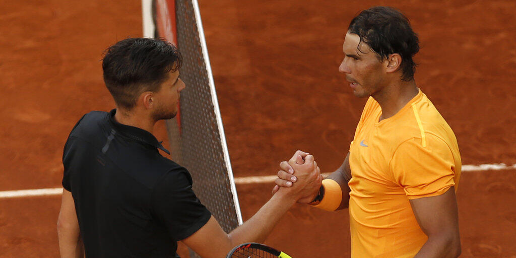 Rafael Nadal (rechts) kann in Rom nicht auf Dominic Thiem treffen: Der Österreicher scheiterte bereits in der 2. Runde