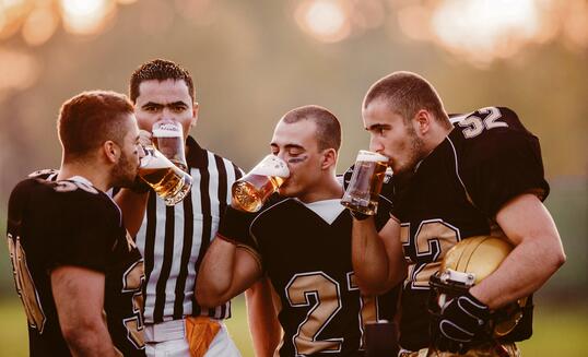American Football Players drinking beer.