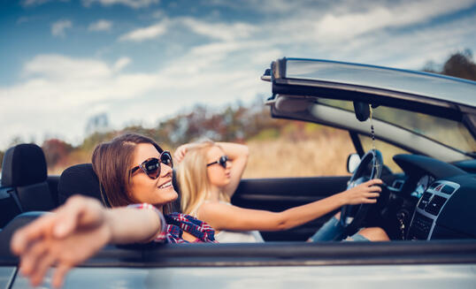 Friends traveling with car