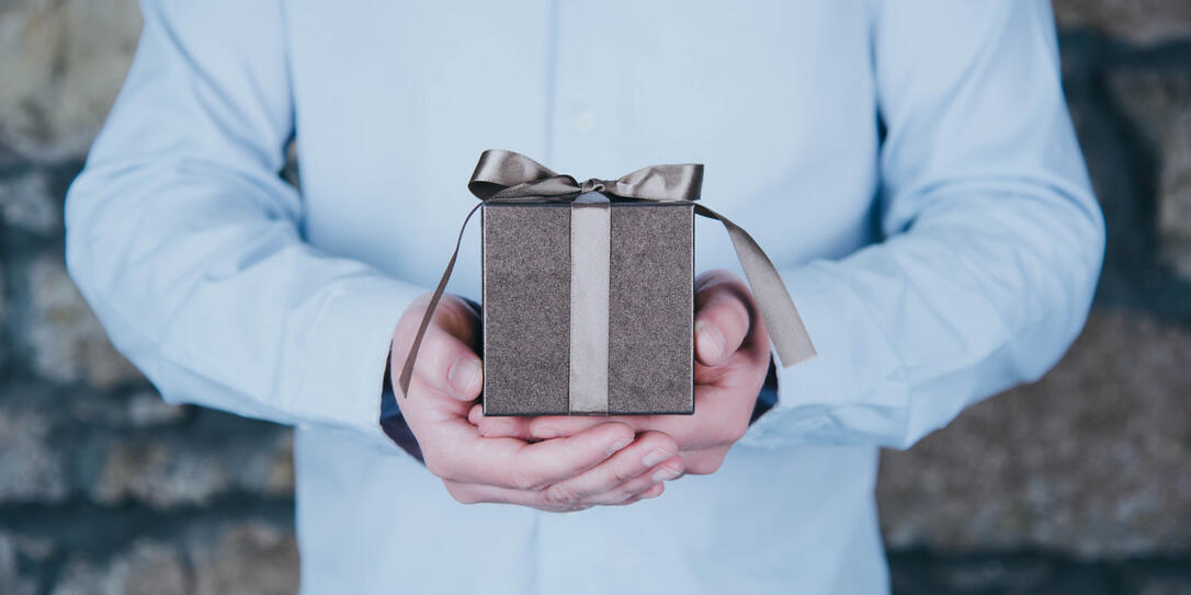 Male hands holding a gift